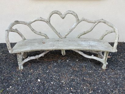 Three reconstituted stone benches simulating...