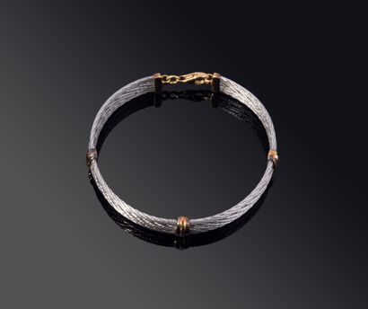 BRACELET in yellow gold (750‰) and twisted...