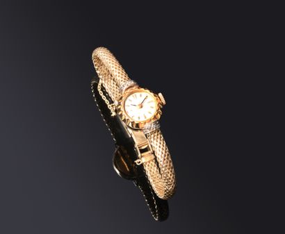 BRACELET MONTRE ronde de dame in yellow gold...