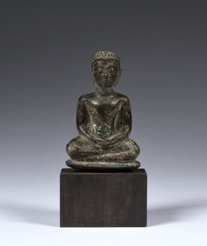 Small seated Buddha in meditation
Thailand,...