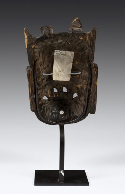 Nuo theater mask featuring Kaishan,
the god...