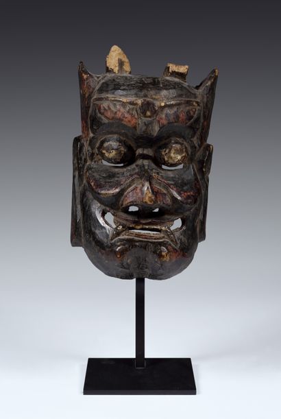 Nuo theater mask featuring Kaishan,
the god...