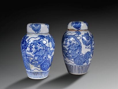 Two covered pots decorated with flowering...