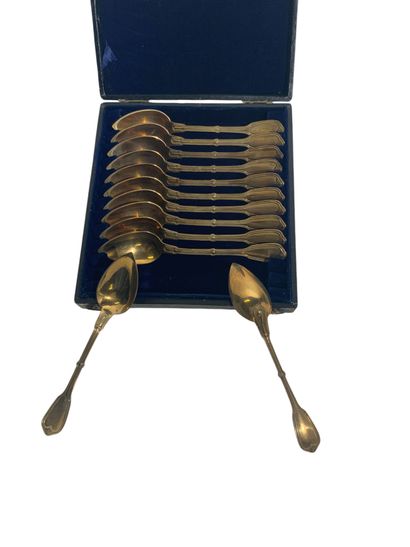 Twelve small vermeil spoons in a jewellery...