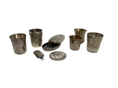 A pewter box, a small flask, a medal decorated...