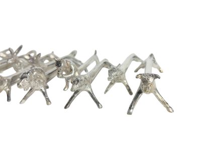 Twelve knife-holders decorated with forest...