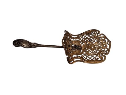 Small silver and vermeil serving scoop, chased...
