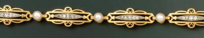 BRACELET articulé en or jaune et platine,...