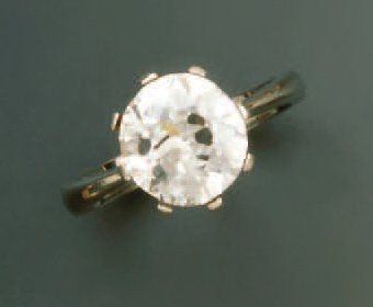 BAGUE EN OR GRIS, sertie d'un diamant rond...