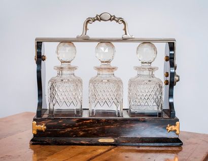 Porte carafe dit Tantalus en bois teinté...
