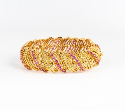 Bracelet articulé à fils godronnés en or...