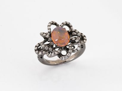 Blackened gold 750°/°° ring centered with...