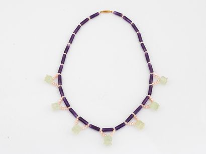 Necklace draped with amethyst sticks and...