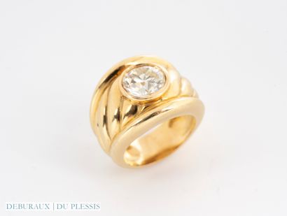 Bague jonc à godrons en or 750°/°° sertie...