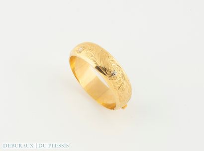 Bracelet jonc ouvrant deux ors 750°/°° à...