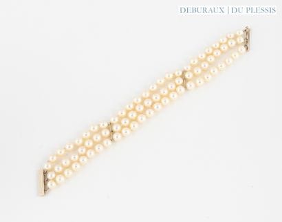 Bracelet with three strands of cultured pearls...