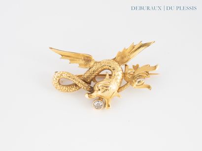 Dragon brooch in 750°/°° gold holding a TA...