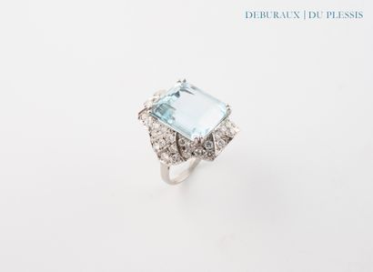 Platinum ring set with a pave aquamarine...