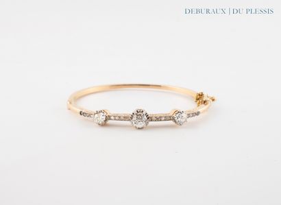 Bracelet jonc ouvrant en or 750°/°° sertie...
