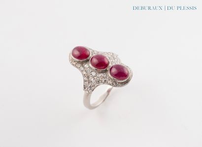 Platinum navette ring set with three ruby...