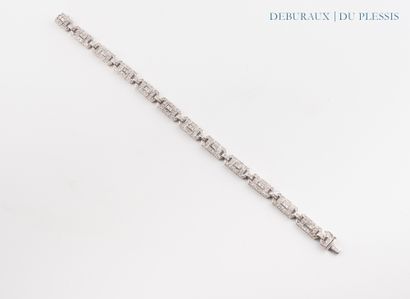 Bracelet articulé en or gris 750°/°° orné...