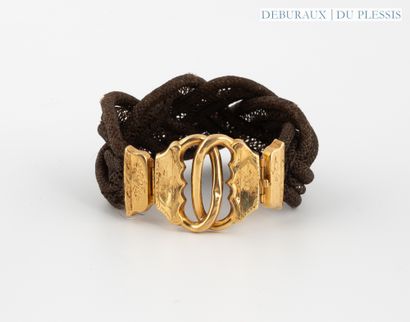Braided hair bracelet with 750°/°° gold chased...