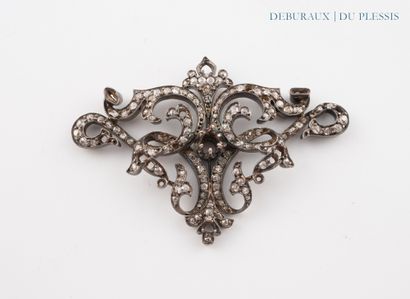 Gold and silver brooch and pendant with leafy...