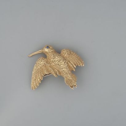 Clip oiseau en or 750 °/°° serti d'un cabochon...