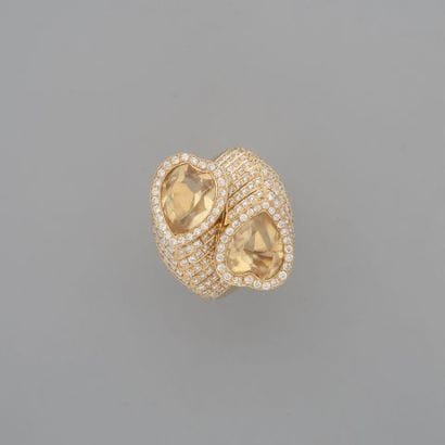 Bague croisée en or 750 °/°° serti clos de...