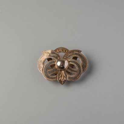 Pendentif en or 750 °/°° à motif d'un nœud,...