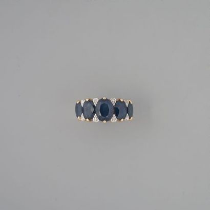 Bague rivière en or 750 °/°° sertie d'une...