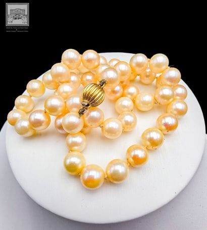 Cultured Pearl Necklace
750/°°° yellow and...