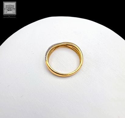 Bague
Or jaune et gris 18K 750/°°°
TDD :...