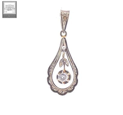 Pendentif
Or jaune et gris 18K 750/°°° poinçon...