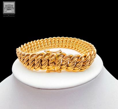 Bracelet en or jaune à mailles tressées 
Travail...
