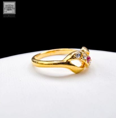 Ring
14K yellow gold 
Set with a small ruby...