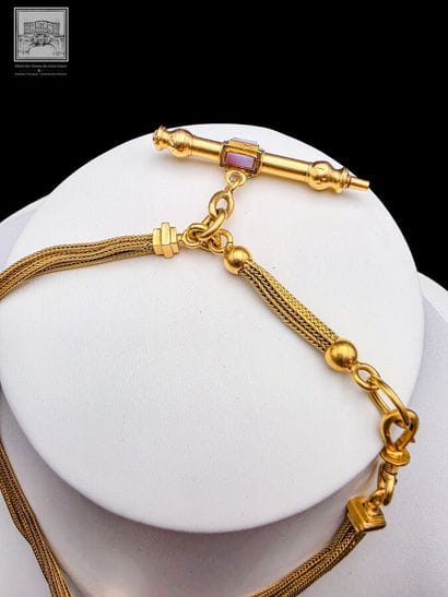 Chaîne de montre en or jaune 18K 750/°°°
Poinçon...