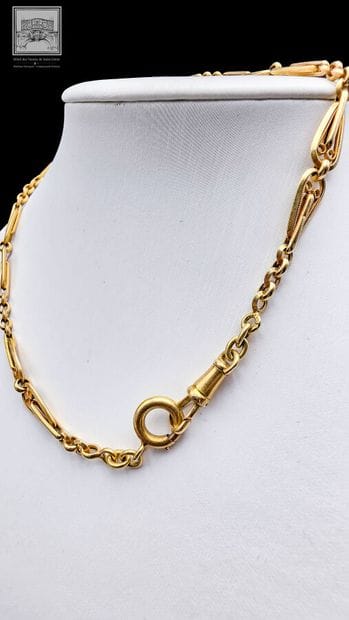 Chaîne de montre 
Or Jaune 18K 750/°°°
Poinçon...