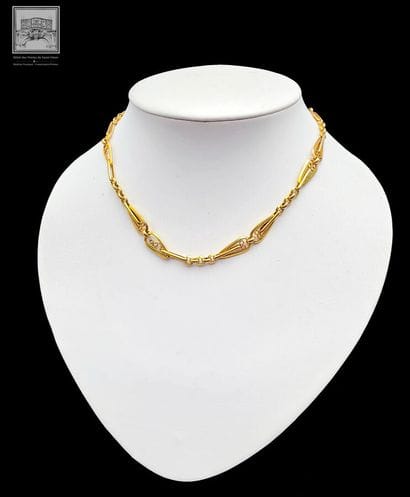 Chaîne de montre 
Or Jaune 18K 750/°°°
Poinçon...