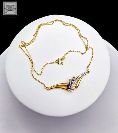 Collier
or jaune et gris 750/°°°
Poinçon...