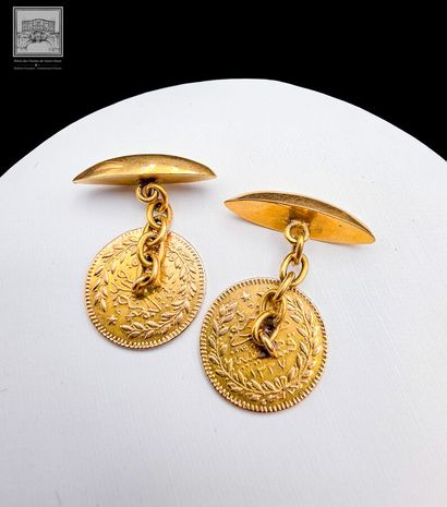 Paire de boutons de manchette
Or 18K 750/°°°
sertie...