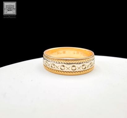 Alliance 
Or jaune et gris 18K 750/°°°
Poinçon...