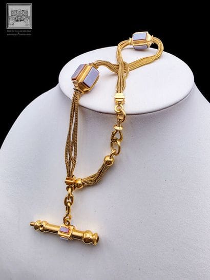Chaîne de montre en or jaune 18K 750/°°°
Poinçon...