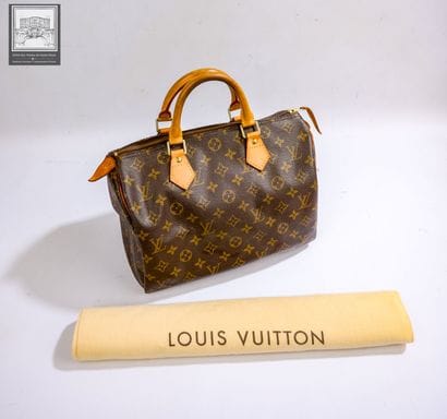 LOUIS VUITTON,
Sac modéle Speedy 30 en cuir...