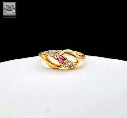 Ring
14K yellow gold 
Set with a small ruby...