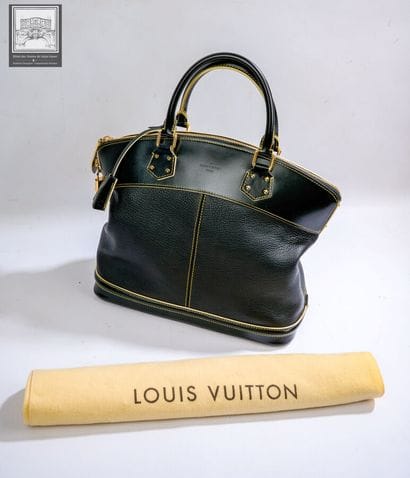 LOUIS VUITTON.
SAC à main modèle Lockit 
Cuir...