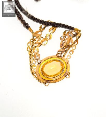 Collier (?) en or jaune 18K 750/°°°
Traces...
