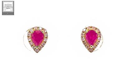 Pair of pear-shaped ear studs in 750°/.(18K)...