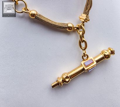 Chaîne de montre en or jaune 18K 750/°°°
Poinçon...