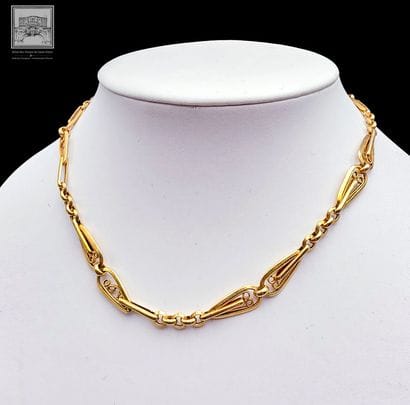 Chaîne de montre 
Or Jaune 18K 750/°°°
Poinçon...